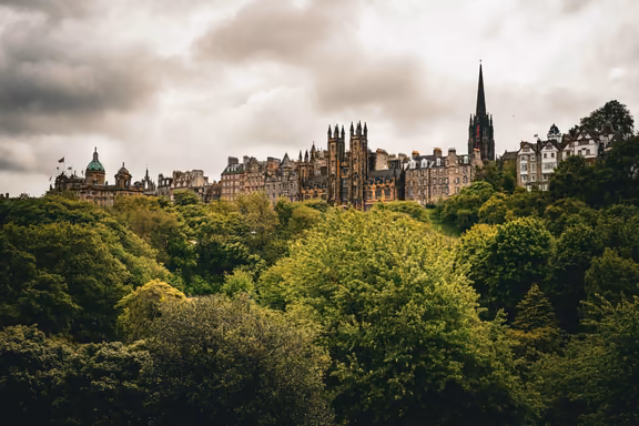 Old Town skyline above the trees of Princes Street Gardens