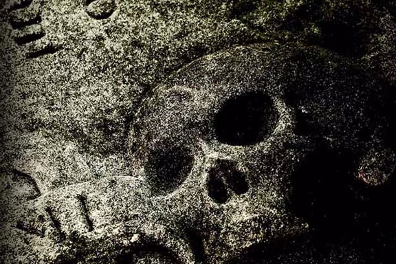 Carved skull on an old gravestone