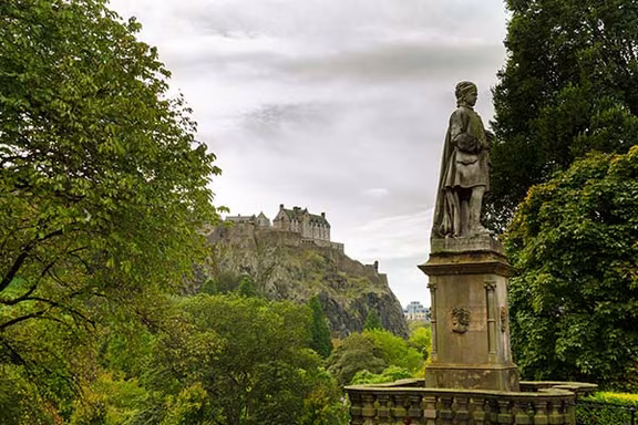 Statue in Princes Street Gardens with the castle behind