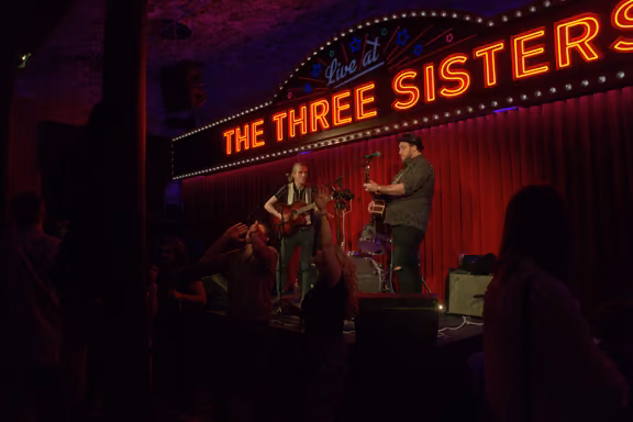 Live band playing on stage at The Three Sisters